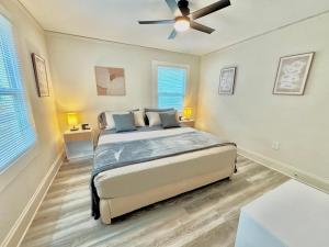 a bedroom with a bed and a ceiling fan at HPThe Haus BOFA Stadium Spectrum Bojangles Dogs in Charlotte