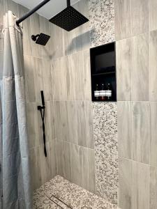 a bathroom with a shower with a shower curtain at HPThe Haus BOFA Stadium Spectrum Bojangles Dogs in Charlotte +32 photos