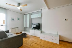 a living room with a couch and a tv at adrimarcangas in Cangas de Onís