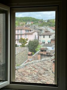 a view of a city from a window at La casa sui tetti di Varzi in Varzi +7 photos