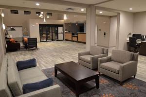a living room with couches and a coffee table in a building at New Roads River Hotel in New Roads +4 photos