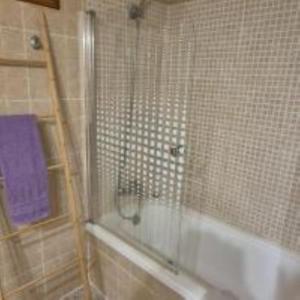 a bathroom with a shower with a tub and a sink at Villa Canescandeu in Port de Pollensa +31 photos
