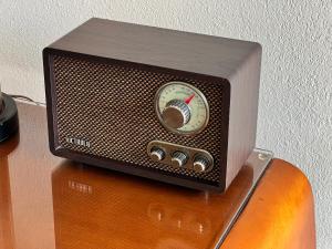 a small radio sitting on top of a table at Roadrunner Lodge Motel in Tucumcari