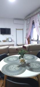 a living room with a table and a couch at Moradia Belo horizonte in Alfena