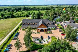 an overhead view of a building with cars parked in a parking lot at Hotel Nowa Holandia in Elblag