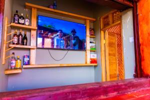 a display window of a bar with two people at Grace villa in Zame