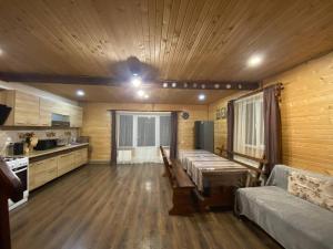 a living room with a couch and a table at Шпінь 2 in Vorokhta