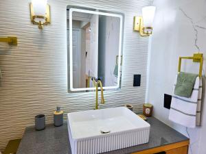 a bathroom with a sink and a mirror at Blue House near Tolantongo Caves in San Miguel +7 photos