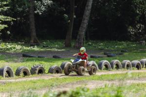 a person riding on a four wheeler on a dirt road at EL COLLELL - Complejo Familiar in Sant Ferriol