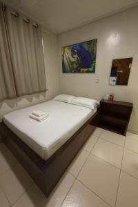 a small bedroom with a bed in a room at Hotel COP 30 in Belém