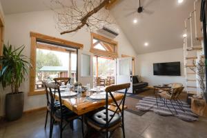 a dining room with a table and chairs at Anasazi Cliffs Lodging in Apple Valley