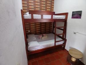 a couple of bunk beds in a room at Hospedaje Campestre Villa Niny in San Gil +32 photos