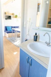 a bathroom with a white sink and a mirror at Louisiana in Anloo +38 photos