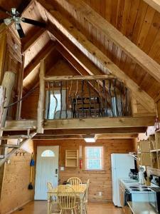 a kitchen and dining room with a loft at Mountain Memories - RRG in Rogers