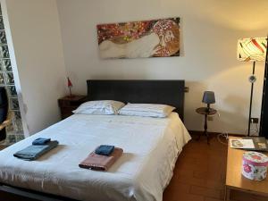 a bedroom with a bed with two towels on it at La Casa Di Cosimo Guest House in San Piero a Sieve