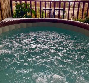 a large pool of water in a backyard at Boho B&B in Amnon