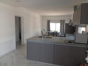 a kitchen with a sink and a counter top at Ein gutes Haus in Mina Clavero