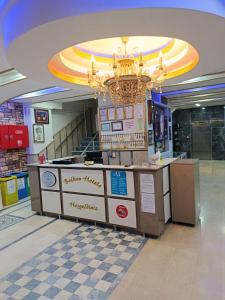 a food counter in a shopping mall with a chandelier at Balkan Palace Edirne in Edirne