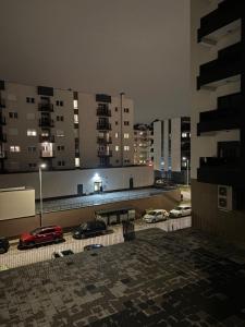 a parking lot with cars parked on the roof of a building at Stan na dan Lana in Vranješ