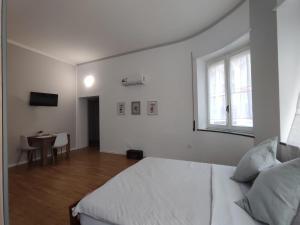 Llit o llits en una habitació de Casa Dante