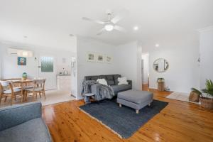a living room with a couch and a table at Salt & Sand - Flynn's Beach in Port Macquarie +13 photos