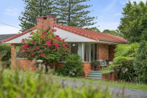 a brick house with a red roof at Salt & Sand - Flynn's Beach in Port Macquarie