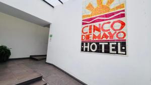 a sign on the wall of a hotel at Cinco de Mayo Hotel in Querétaro