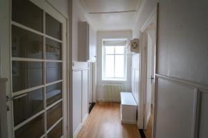 an empty room with a closet and a window at Spacious 3-Bedroom Apartment with Comfy Beds in Central Vágur, Island of Suðuroy in Vágur