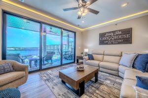 a living room with a couch and a table at Family Tides Condo for 8 in Osage Beach +34 photos