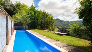 a swimming pool in the backyard of a house at Bisabuela Martina in Liendo