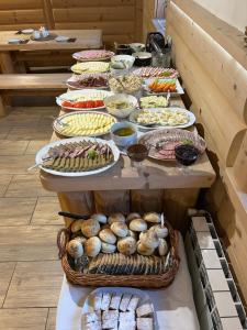 a buffet line with many different types of food at u Lucyny w Białce Tatrzańskiej- jacuzzi i sauna w ogrodzie in Białka Tatrzańska