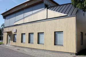 a building with windows on the side of it at Hostel Sport in Haapsalu