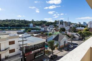 an aerial view of a city with buildings at Hotel Letto Caxias in Caxias do Sul