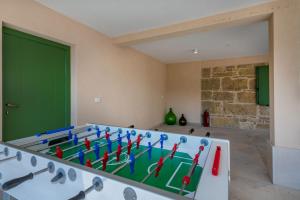 a room with a ping pong table with darts at Villa Gino in Pazin