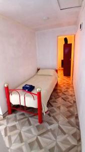 a bedroom with a bed and a room with a door at La Mejor-A in Comandante Luis Piedra Buena