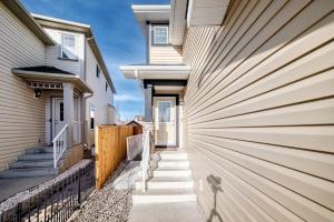 a walkway between two houses at Cozy Vacation Home in Calgary