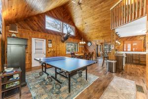 a dining room with a ping pong table in a house at Grace Place in Watersmeet