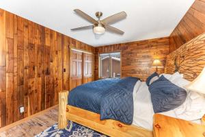 a bedroom with a bed and a ceiling fan at Grace Place in Watersmeet