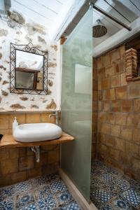 a bathroom with a sink and a mirror at Villa Roba degli Ulivi in Agrigento +27 photos