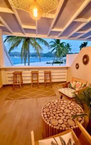 a living room with a view of the ocean at Tropical moon in Saint Martin