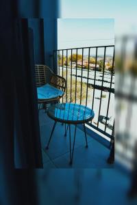 a balcony with a table and a chair and a view at Lynwood Circa 209 in Pretoria