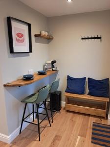 a bar in a room with chairs and a table at An Sealladh in Fort William
