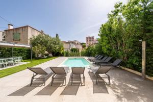 a group of chairs and a swimming pool at Villa Rosoliel in Cannes