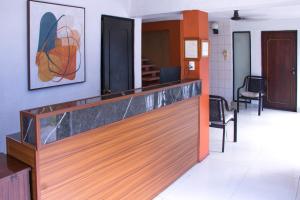 a lobby with a reception desk with a counter at Hotel Posada del Angel in Mérida