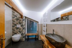 a bathroom with a sink and a bath tub at Haus Tisch in Schruns +109 photos