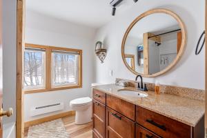a bathroom with a sink and a mirror at Strathmere Country Retreat in Ottawa +217 photos