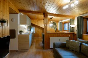 a living room with a couch and a kitchen at Haus Tisch in Schruns