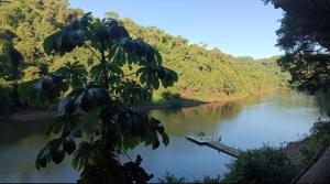a river with a boat in the middle of it at Casa roja in Eldorado