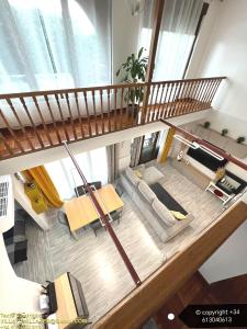 an overhead view of a living room with a staircase at VILLA TOMILLARES in Los Tomillares +31 photos