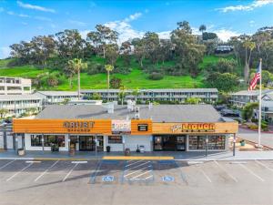an empty parking lot in front of a store at The Atwood Hotel San Diego - SeaWorld/Zoo in San Diego